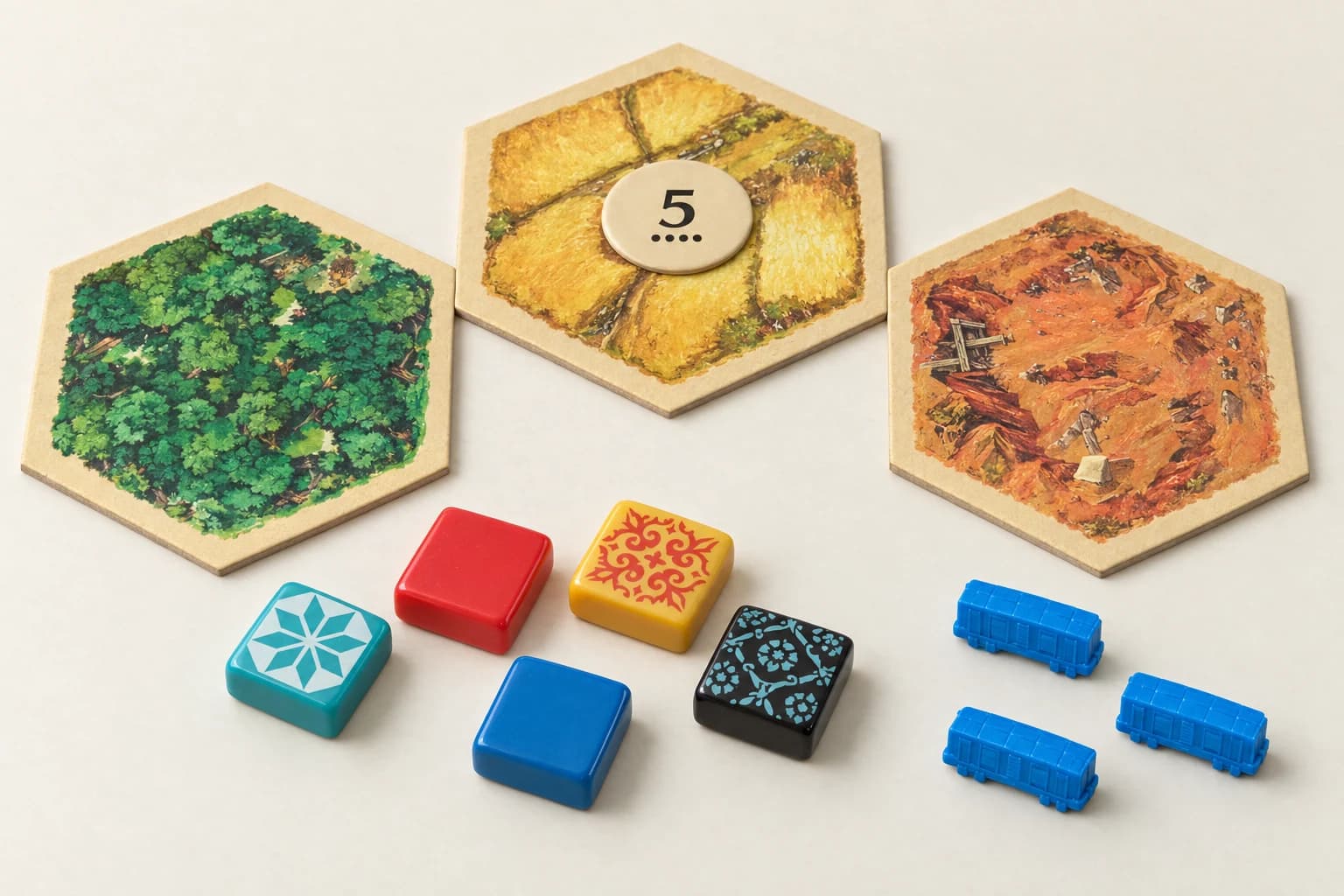 Illustration de jeux de société : tuiles de CATAN, carreaux colorés et petits wagons bleus.